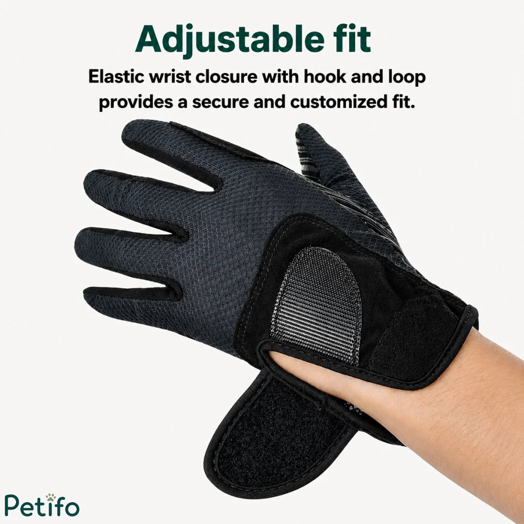 Close-up of the adjustable elastic wrist closure with hook-and-loop fastener on a black riding glove.