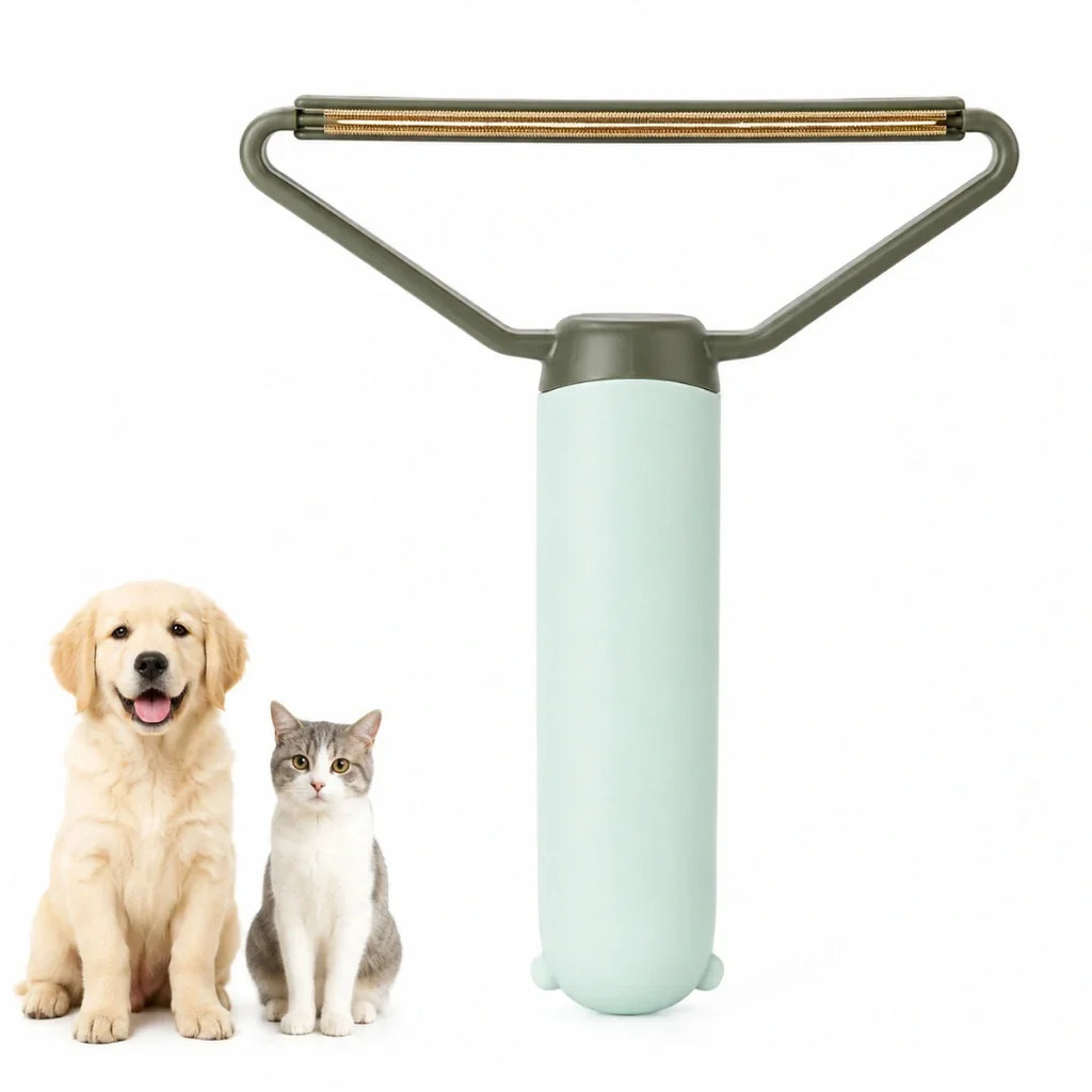 Mint green pet lint remover displayed next to an adorable golden retriever puppy and a cat.