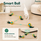 White cat watching a smart moving ball navigate across a room while successfully avoiding obstacles and furniture edges.