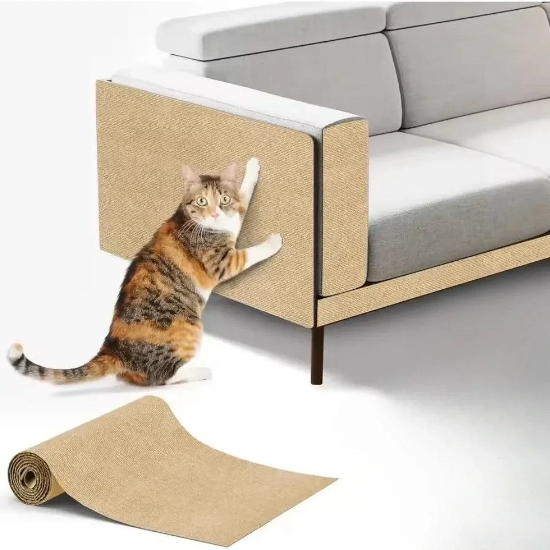 Studio product shot showing a calico cat scratching a beige Petifo cat scratch mat applied to the armrest of a modern sofa, with an unrolled beige mat in the foreground.