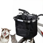 Studio photo of a husky dog and grey cat posing next to the mounted black Petifo bike basket.