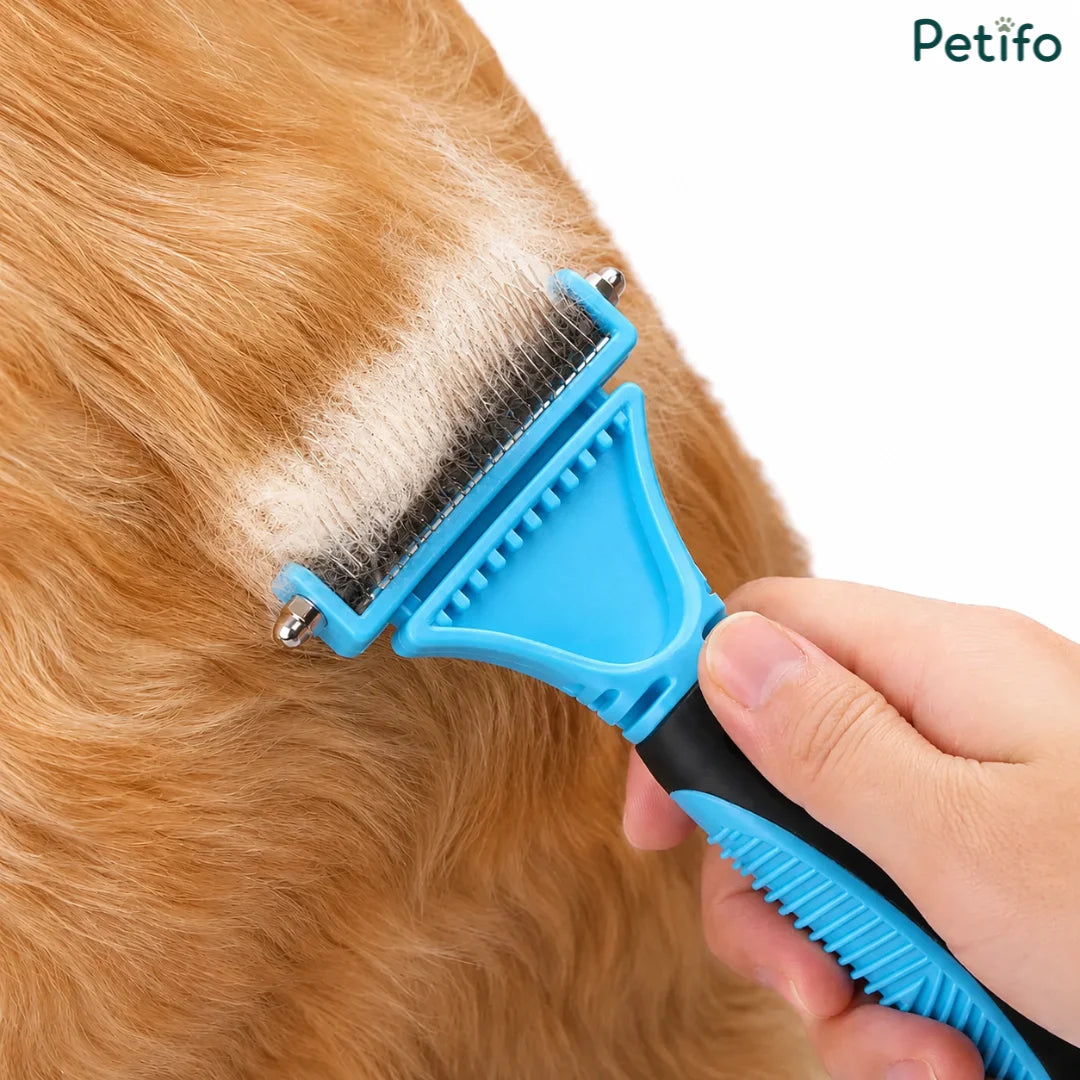 Petifo blue and black deshedding comb being used to effectively remove loose undercoat fur from a golden-brown dog.
