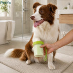 Border collie dog sitting calmly while having its paw cleaned with the Petifo portable washer