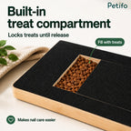 Close-up view of the built-in treat compartment filled with brown kibble pieces.