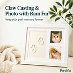 Promotional banner showcasing a white pet memory frame with clay paw casting and two cat photographs next to a knitted blanket.