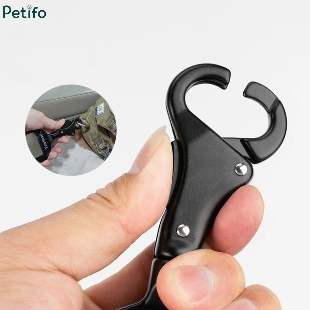 Close-up of hand holding open Petifo safety clip hook mechanism