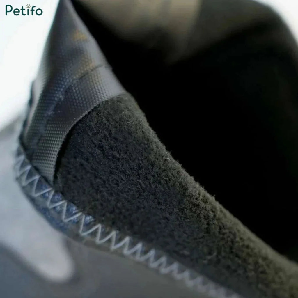 Close-up view of the soft black fleece interior lining inside a thermal dog boot.