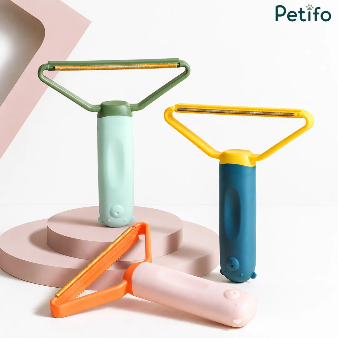 Group display of four colorful pet hair remover tools in green/mint, blue/yellow, and peach/orange.