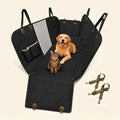 A black quilted car back seat cover with pets inside, featuring side flaps and detachable straps.
