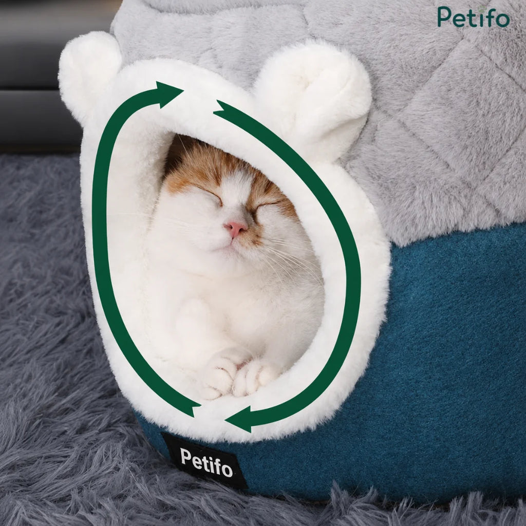Happy cat sleeping peacefully inside the cozy Petifo hooded cat cave bed
