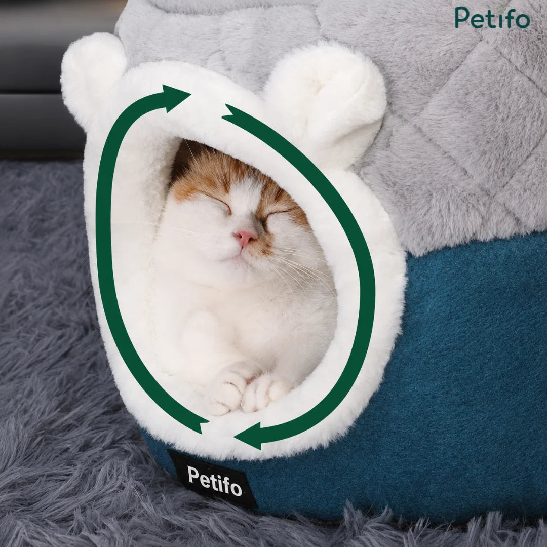Happy cat sleeping peacefully inside the cozy Petifo hooded cat cave bed