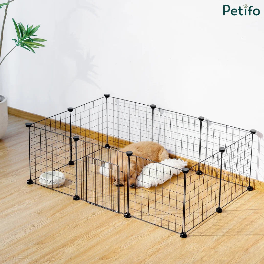 Cute puppy sleeping on a cozy bed inside a Petifo black wire dog playpen at home.