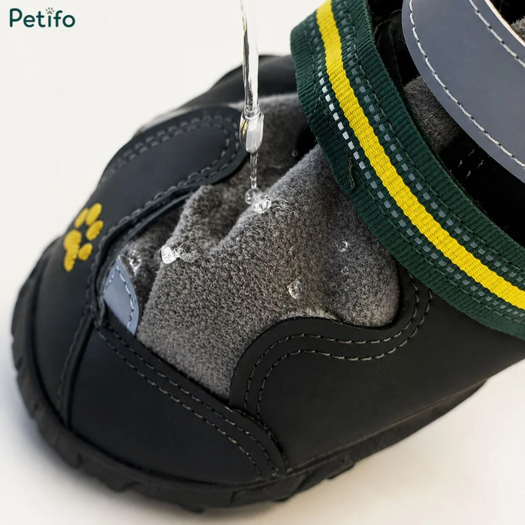 Close-up demonstration of water droplets beading off the waterproof fabric and durable outer shell of a dog shoe.