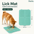 Dog eating from a teal Petifo lick mat with clear dimensions of 24.5 by 30.5 cm