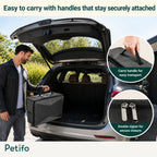 Man carrying the travel cat litter box featuring secure carry handles and double zippers.