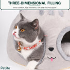 Close-up of a grey cat peeking out from the dual-hole entrance of the Petifo nest, highlighting its three-dimensional filling and secure support.
