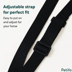 Close-up of durable black adjustable straps and plastic buckle on an equestrian hay bag.
