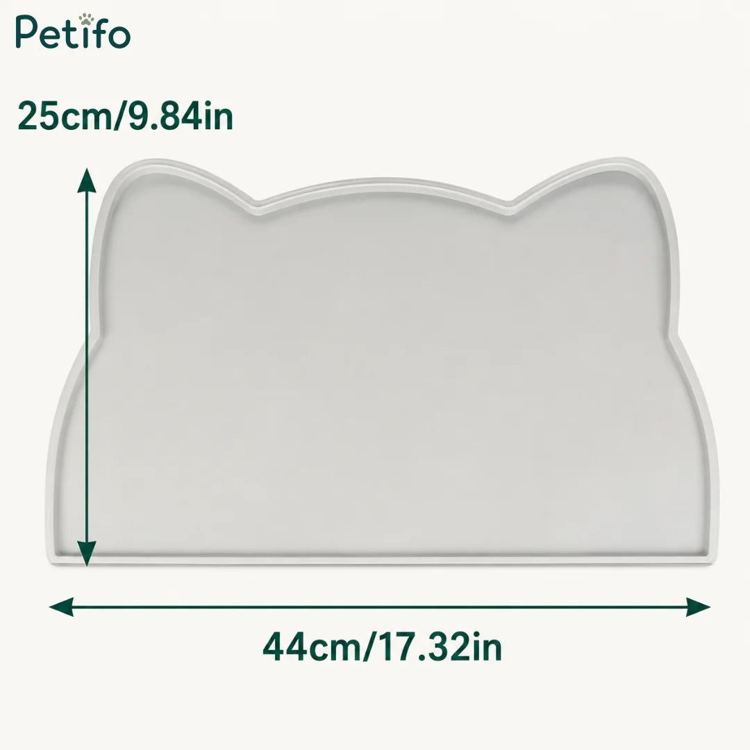 Dimension diagram of the cat-ear-shaped gray silicone pet mat showing measurements of 44 cm / 17.32 in wide and 25 cm / 9.84 in tall.