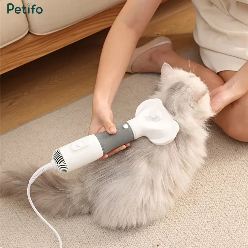 Petifo pet grooming dryer being used to gently brush and dry a fluffy white cat.
