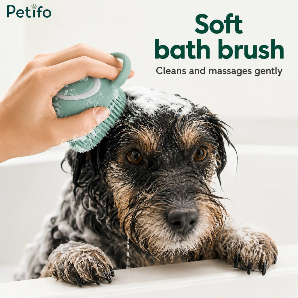 A wet scruffy dog being gently massaged in the tub with the Petifo mint green bath brush.