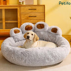 Gray plush paw-shaped dog bed featuring a yellow room interior and wooden cabinet background.