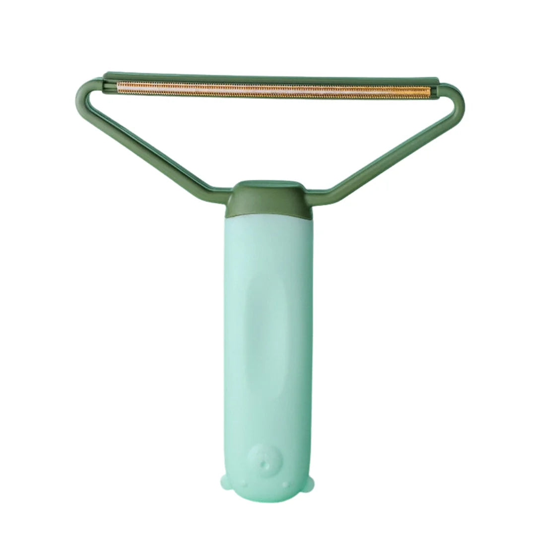Mint green and dark green pet hair lint remover tool with a triangular metal scraping edge.