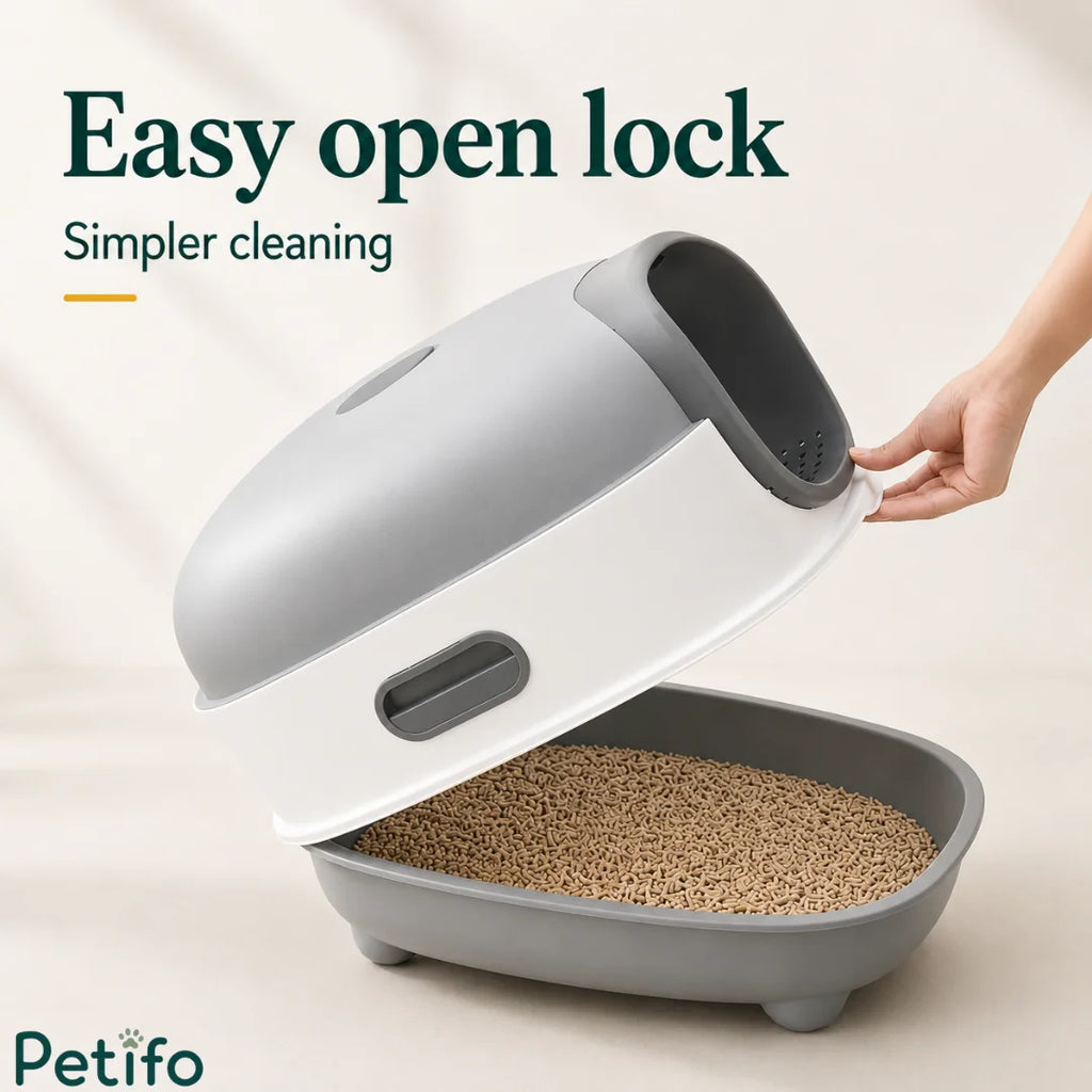 Person demonstrating the easy open lock mechanism of the grey and white hooded cat litter box for simpler daily cleaning.