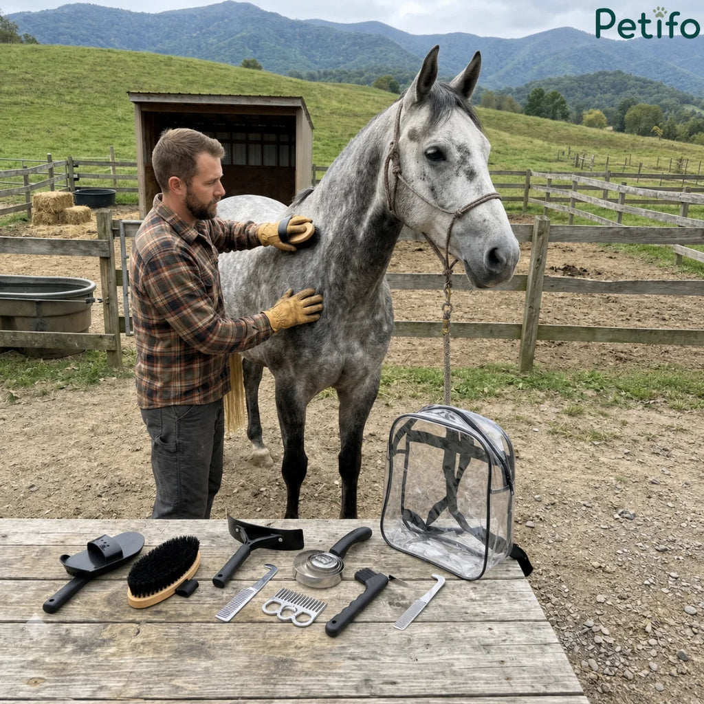 Man grooming a grey horse outdoors with grooming tools and clear backpack displayed on a wooden table.