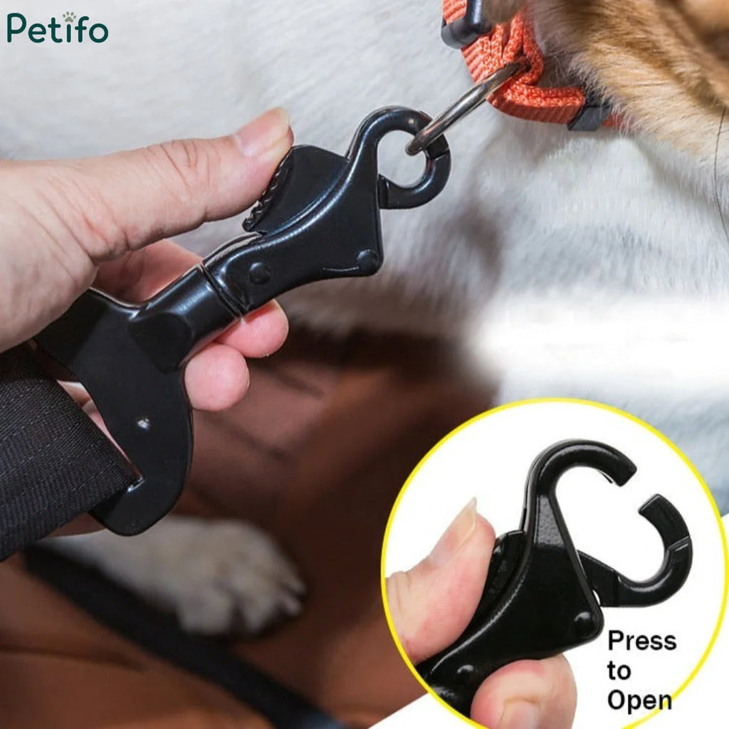 Hand attaching Petifo quick-release clip to dog collar ring with insert showing press-to-open mechanism