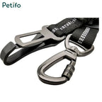 Detailed view of the heavy-duty metal seat belt buckle and swivel locking carabiner.