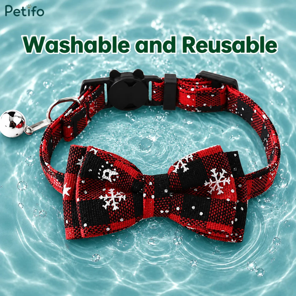 Red and black plaid Christmas cat collar placed on water to highlight its washable and reusable material.
