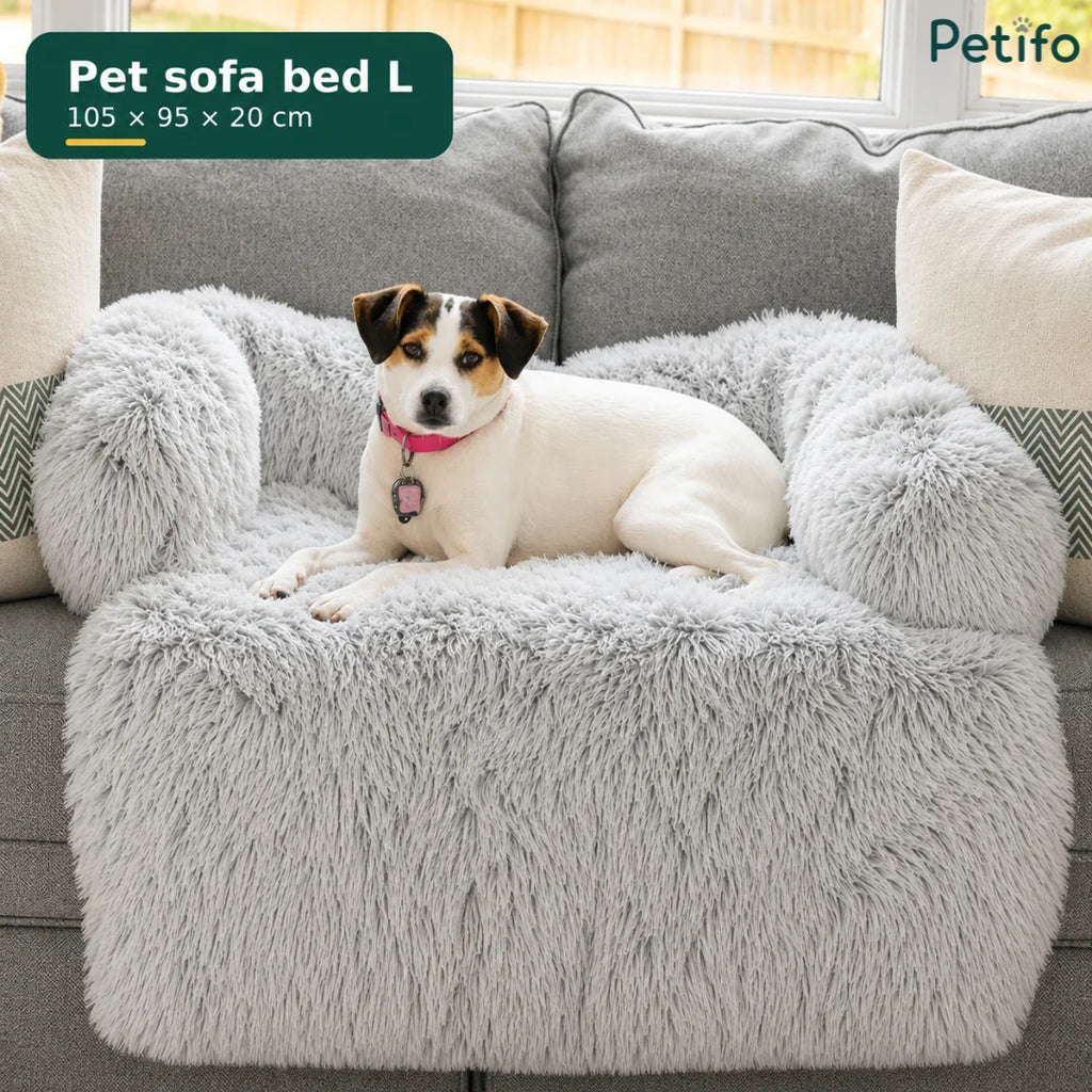 Large grey Petifo pet sofa bed placed on a living room couch with a small dog sitting on it.