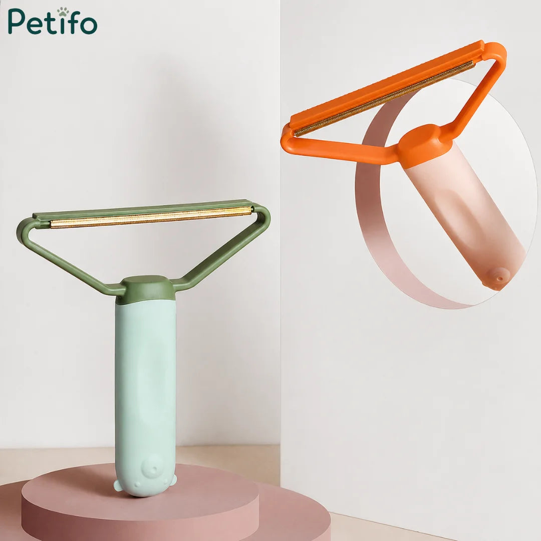 Studio product display showing a mint green lint remover on a podium alongside a floating peach variant.