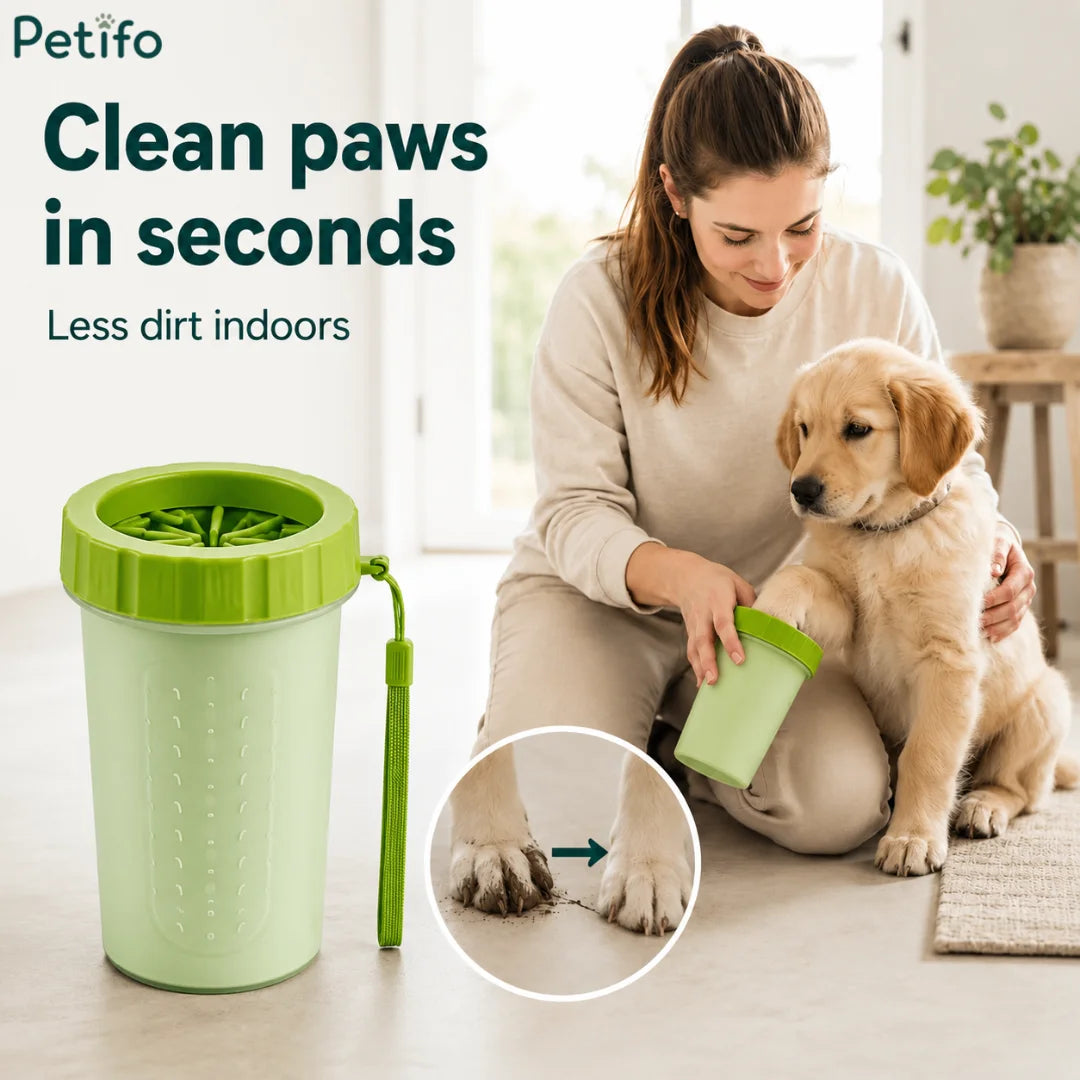 Happy golden retriever puppy having muddy paws cleaned quickly with the Petifo paw washer
