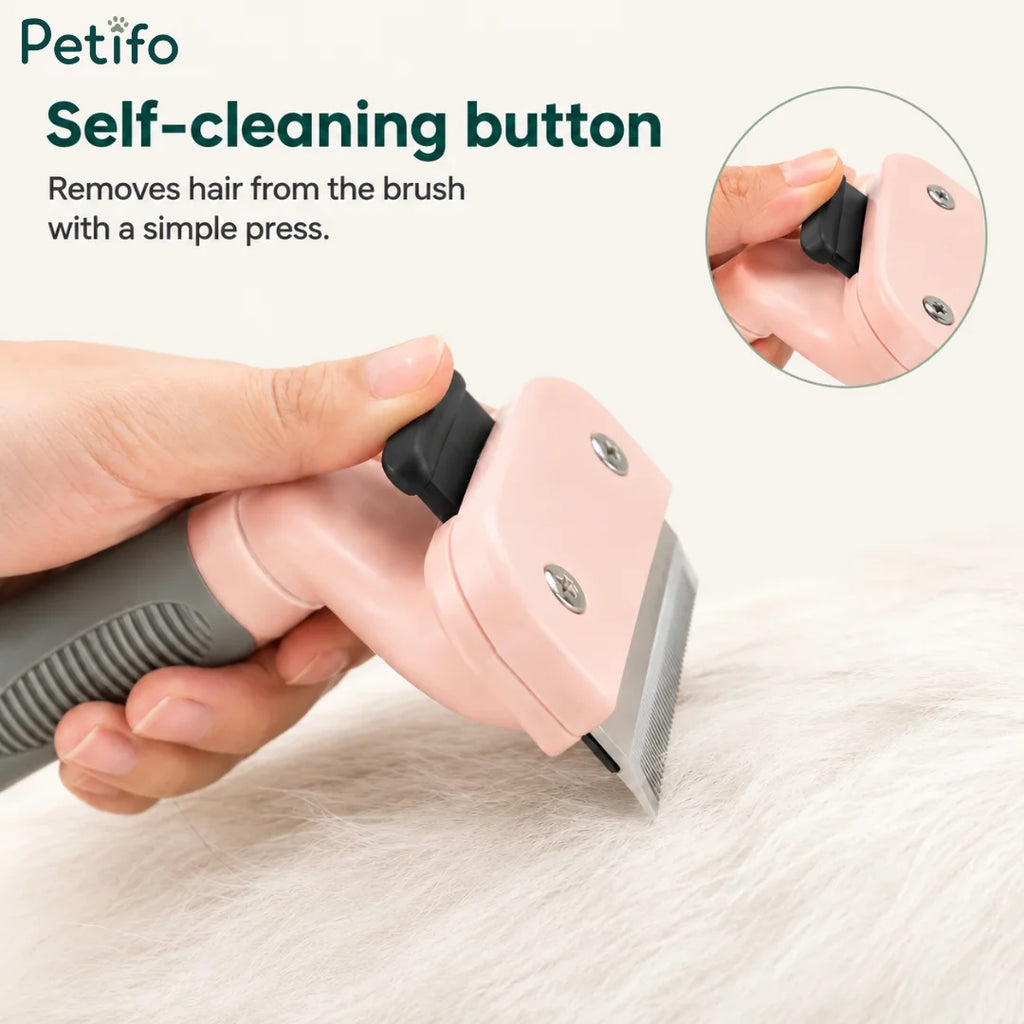 Demonstration of the one-click self-cleaning button easily removing trapped fur from the pink pet brush.