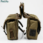 Pair of olive green canvas saddle bags shown against a white background.