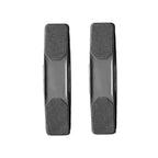 Pair of black flexible rubber grooming brushes displayed side by side for comparison.
