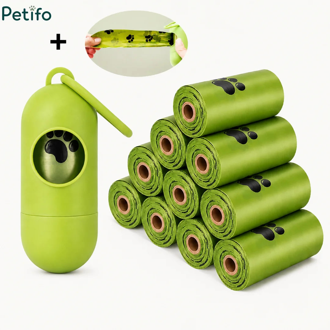 Green dog waste bag dispenser paired with a stack of paw-print patterned refuse bag rolls. 