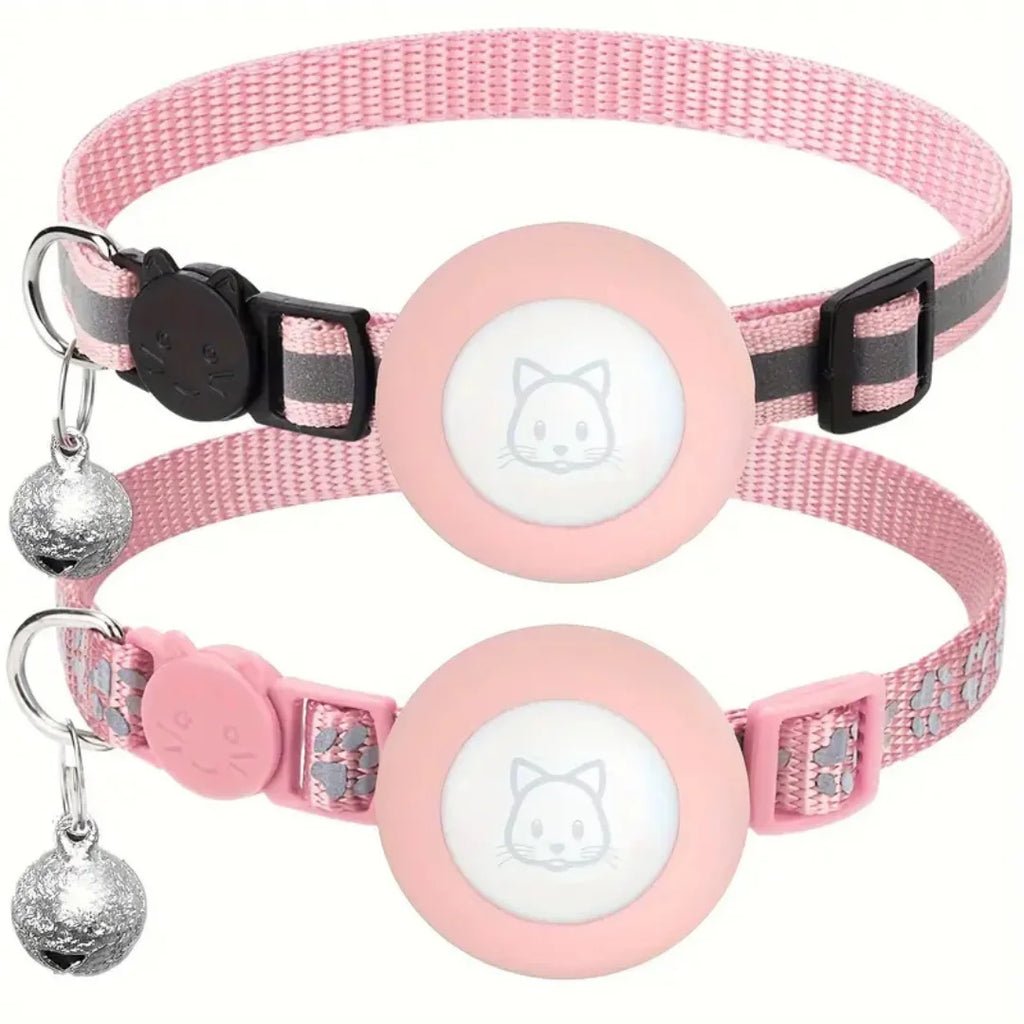 Pink reflective cat collars featuring secure AirTag cases, cat-face safety buckles, and dangling silver bells.