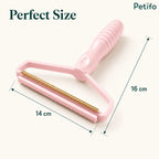 Pink pet hair remover tool with precise dimensions of 14 cm width and 16 cm height.