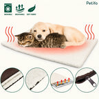 A puppy and a kitten sleeping together on the self-warming pet mat, featuring icons for "washable", "breathable", and "soft fabric" at the top, along with four circular detail insets at the bottom showing the layers, texture, heat reflection, and zipper.