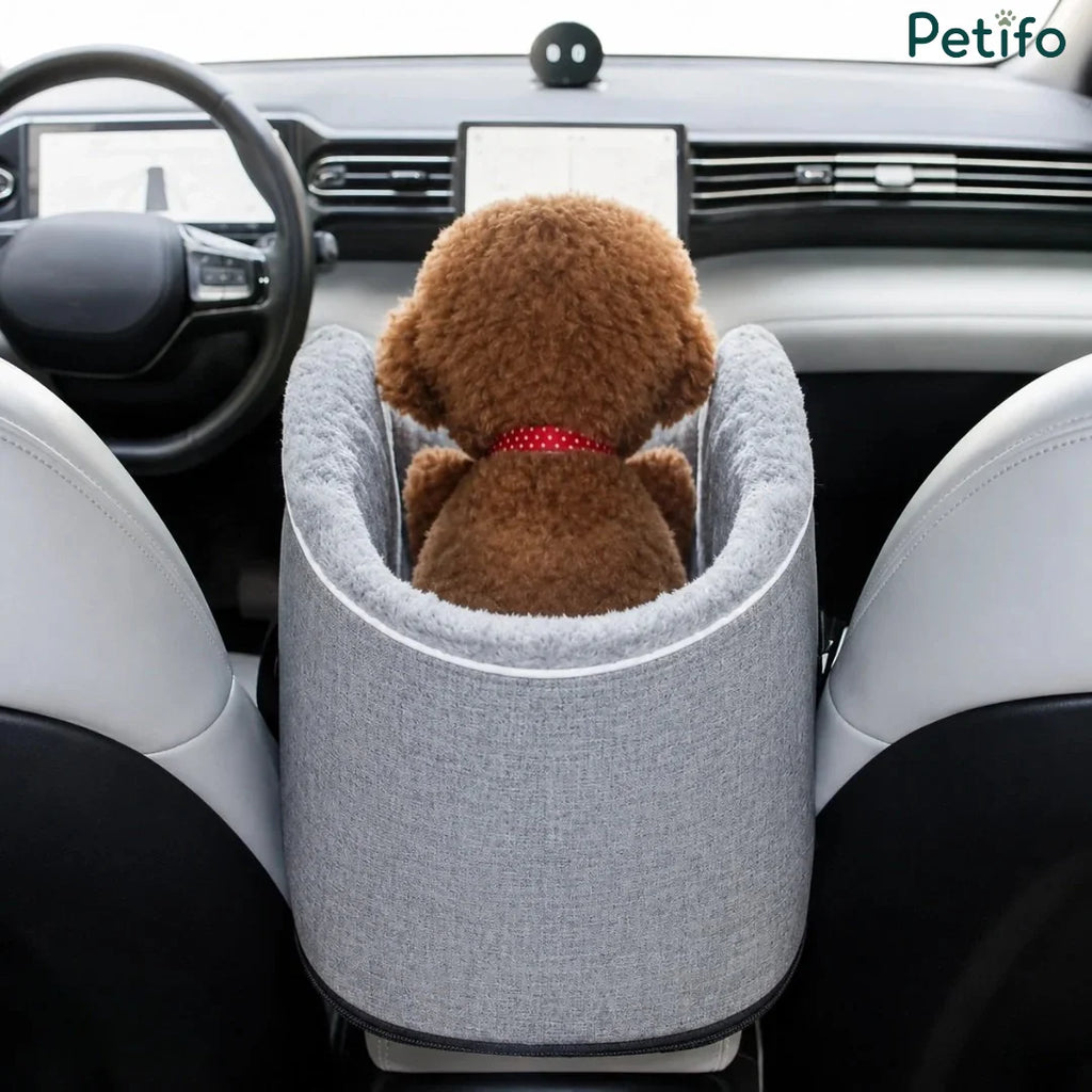 Rear view of plush teddy dog sitting in Petifo center console car seat between front seats