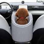 Rear view of plush teddy dog sitting in Petifo center console car seat between front seats