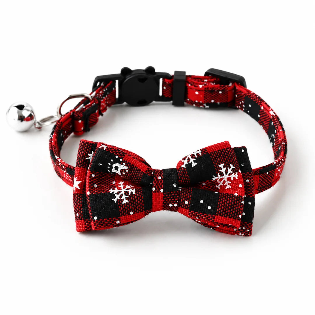 Red and black plaid Christmas cat collar featuring a bow tie and bell.