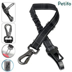 Complete view of the black reflective adjustable pet safety restraint featuring multiple attachment clips.