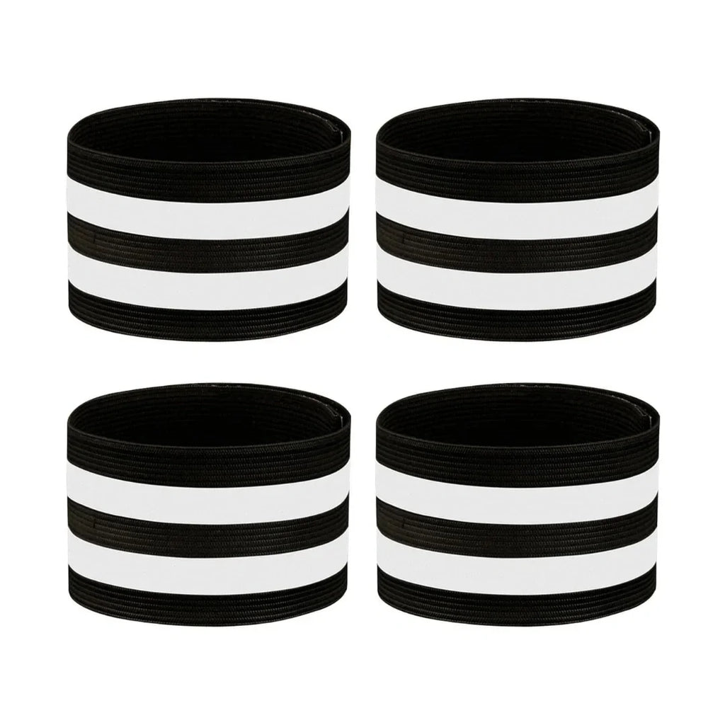 Four black and white reflective horse leg bands arranged on a white background.
