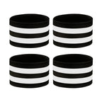 Four black and white reflective horse leg bands arranged on a white background.