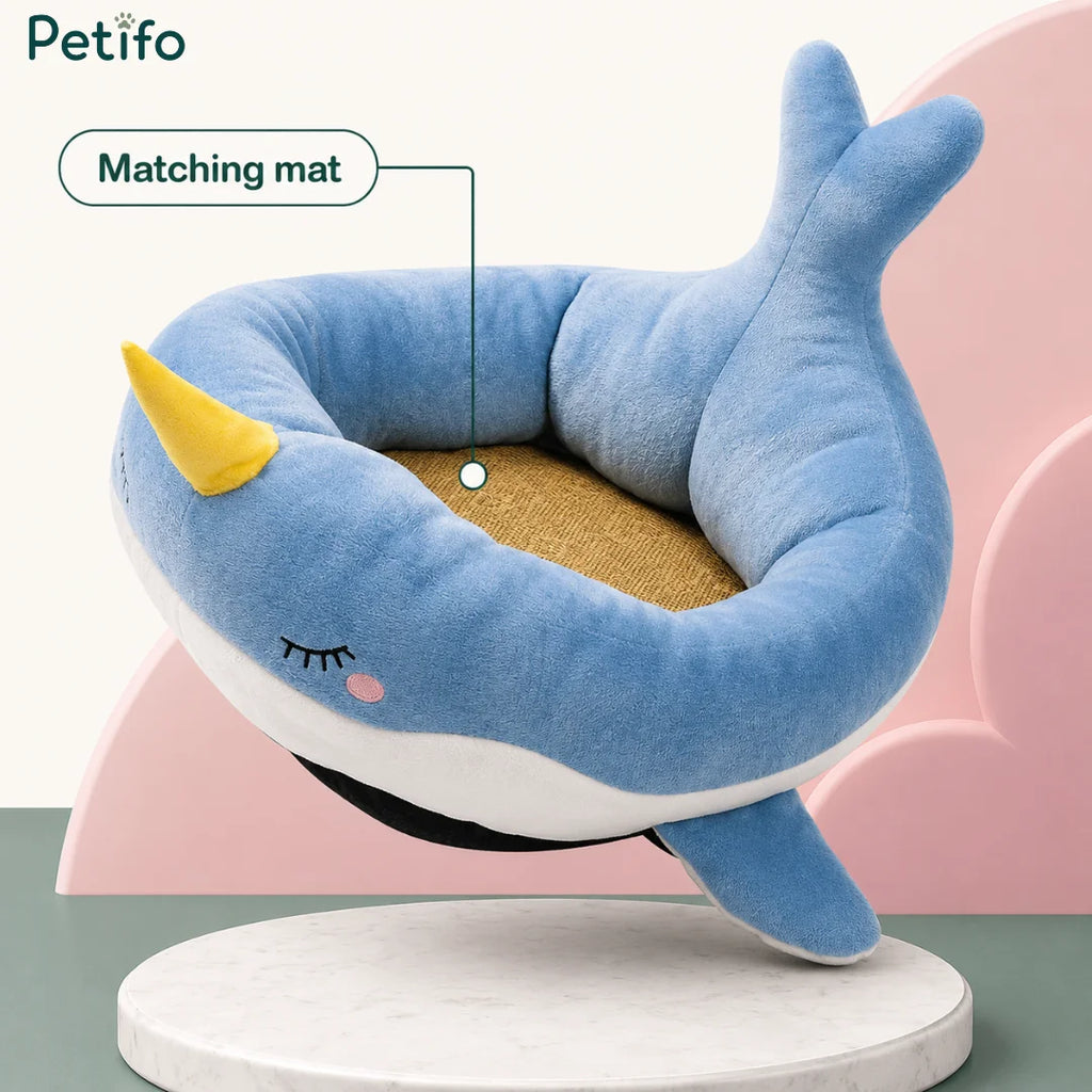 Petifo blue narwhal plush cat bed featuring a matching removable interior mat.