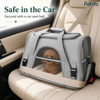 Petifo grey pet carrier safely secured with a seatbelt on a car seat.