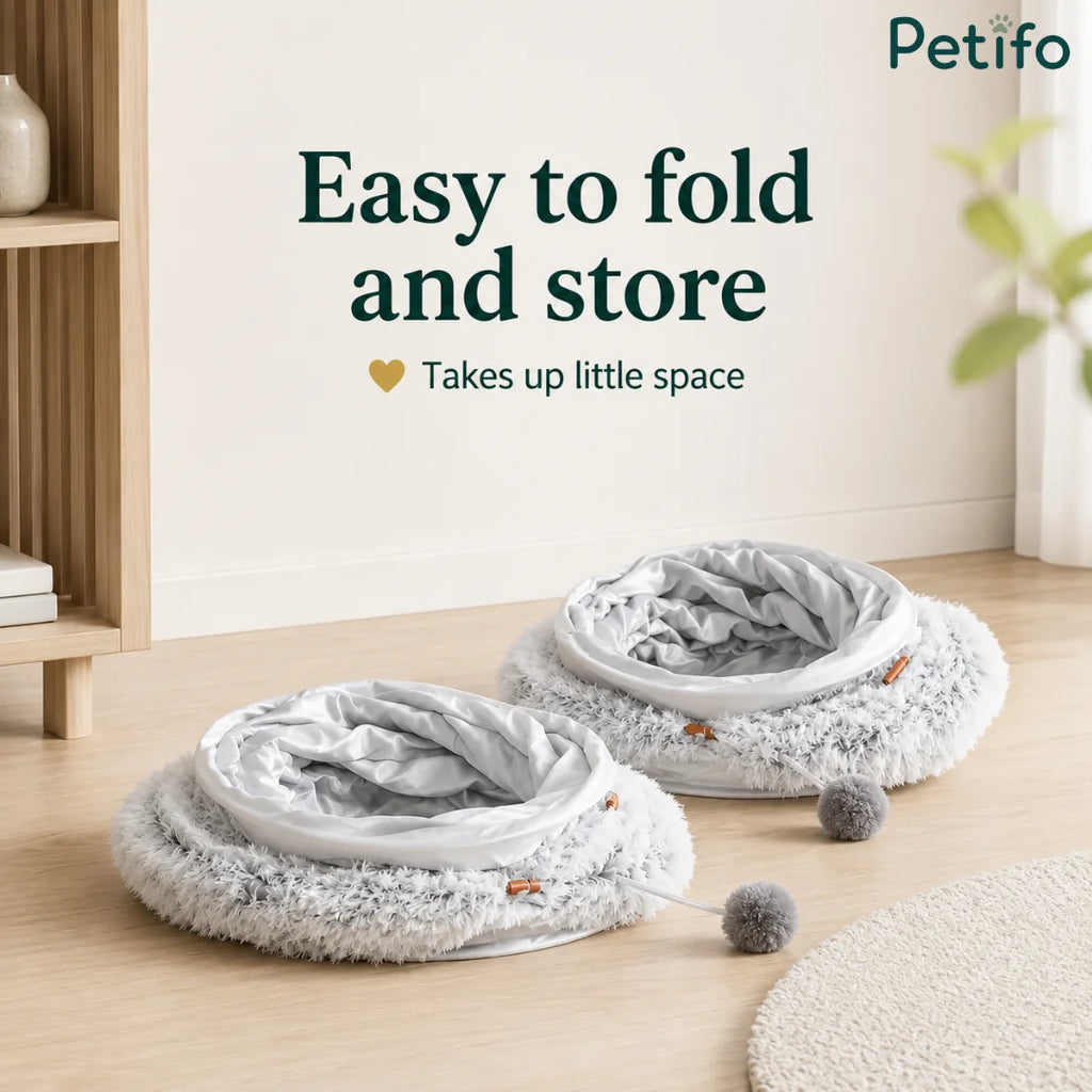 Two folded gray donut cat beds stacked neatly on a wooden floor to demonstrate space-saving storage.
